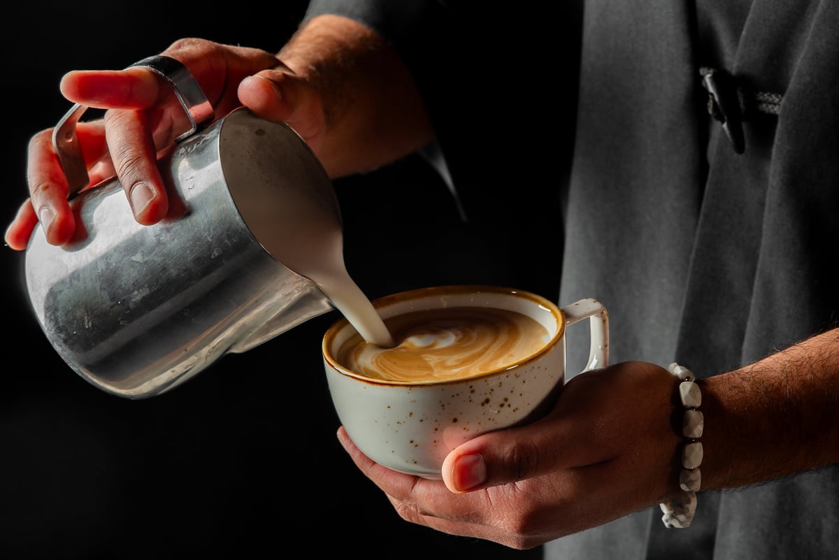 Barista pouring latte art